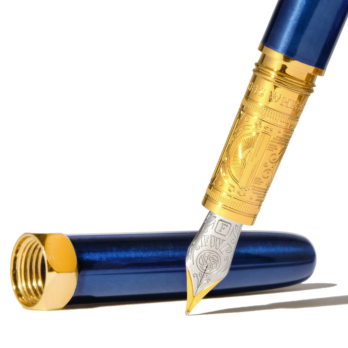 Green fountain pen featuring a steel nib with gold-plated engravings. Wordkind.