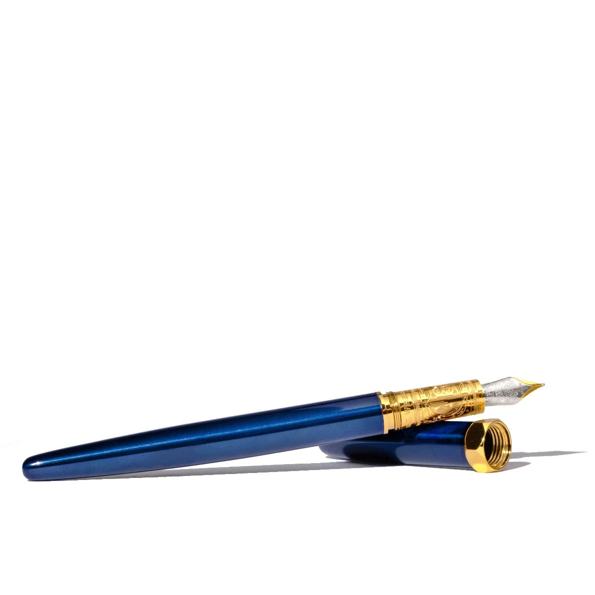 Sapphire blue fountain and cap against a white background. Wordkind.