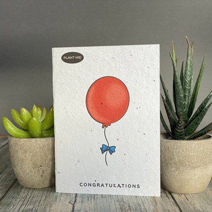 Seed paper greeting card featuring a red balloon with congratulations written underneath.