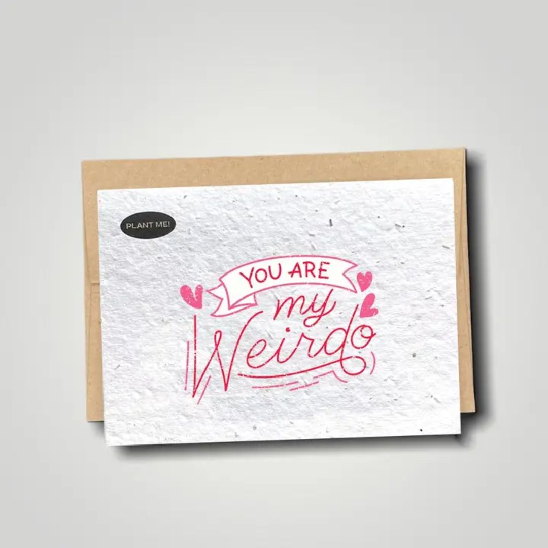 Seed paper greeting card with you are my weirdo in pink text. Wordkind.
