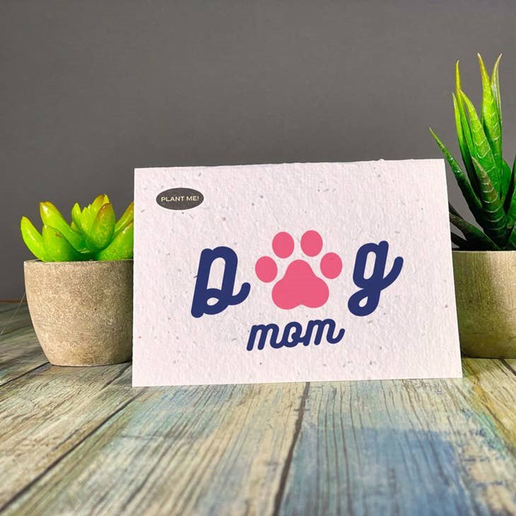 Seed paper greeting card with Dog Mom in blue script, pink paw print replacing the O. Wordkind.