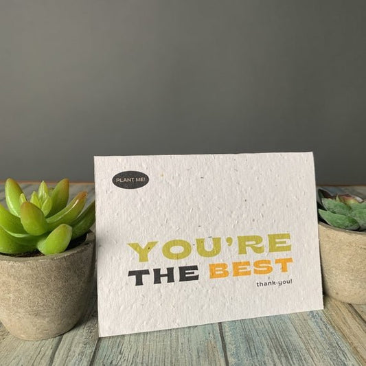 Seed paper thank you card with you’re the best, thank you in green, black, and orange text. Wordkind.